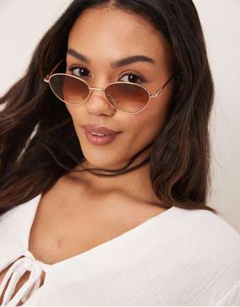 metal cateye sunglass in gold with pink lens